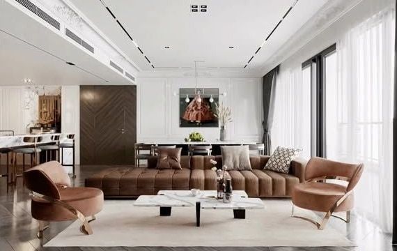 Taba deri kapitoneli koltuk, mermer sehpalar ve beyaz panelli duvarlarla aydınlık salon